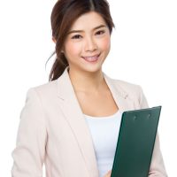 young-asian-businesswoman-with-clipboard-2021-08-30-07-22-17-utc.jpg